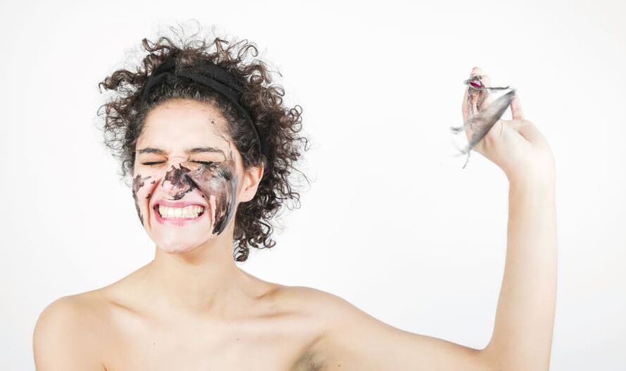 a woman performs a rejuvenating facial skin treatment